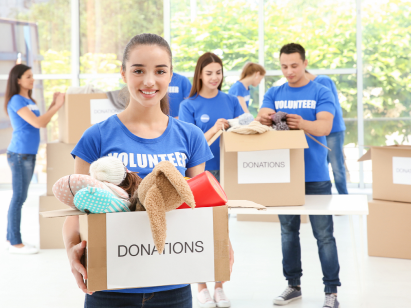 Girl donating items to receive a tax deduction